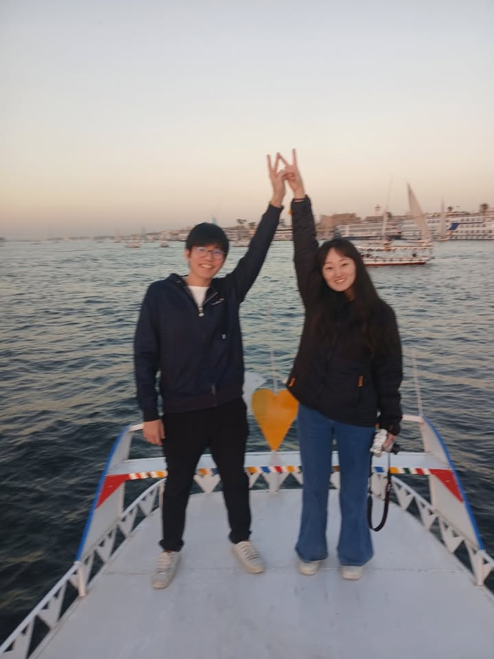 Guests sailing on the Nile at sunset